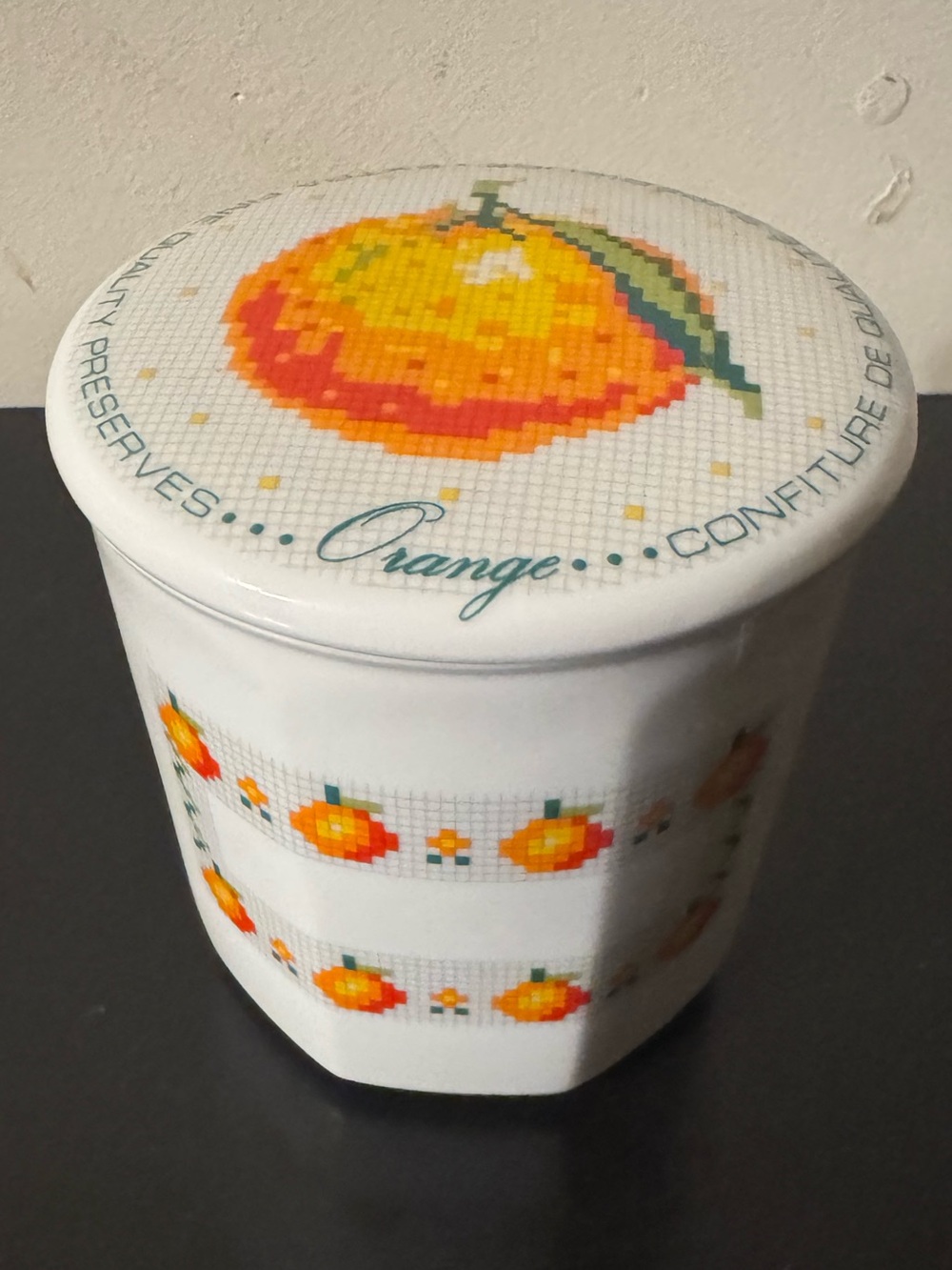 Toscany Collection Porcelain 12oz Orange Jam Jar w/ Lid. Has a crack as shown